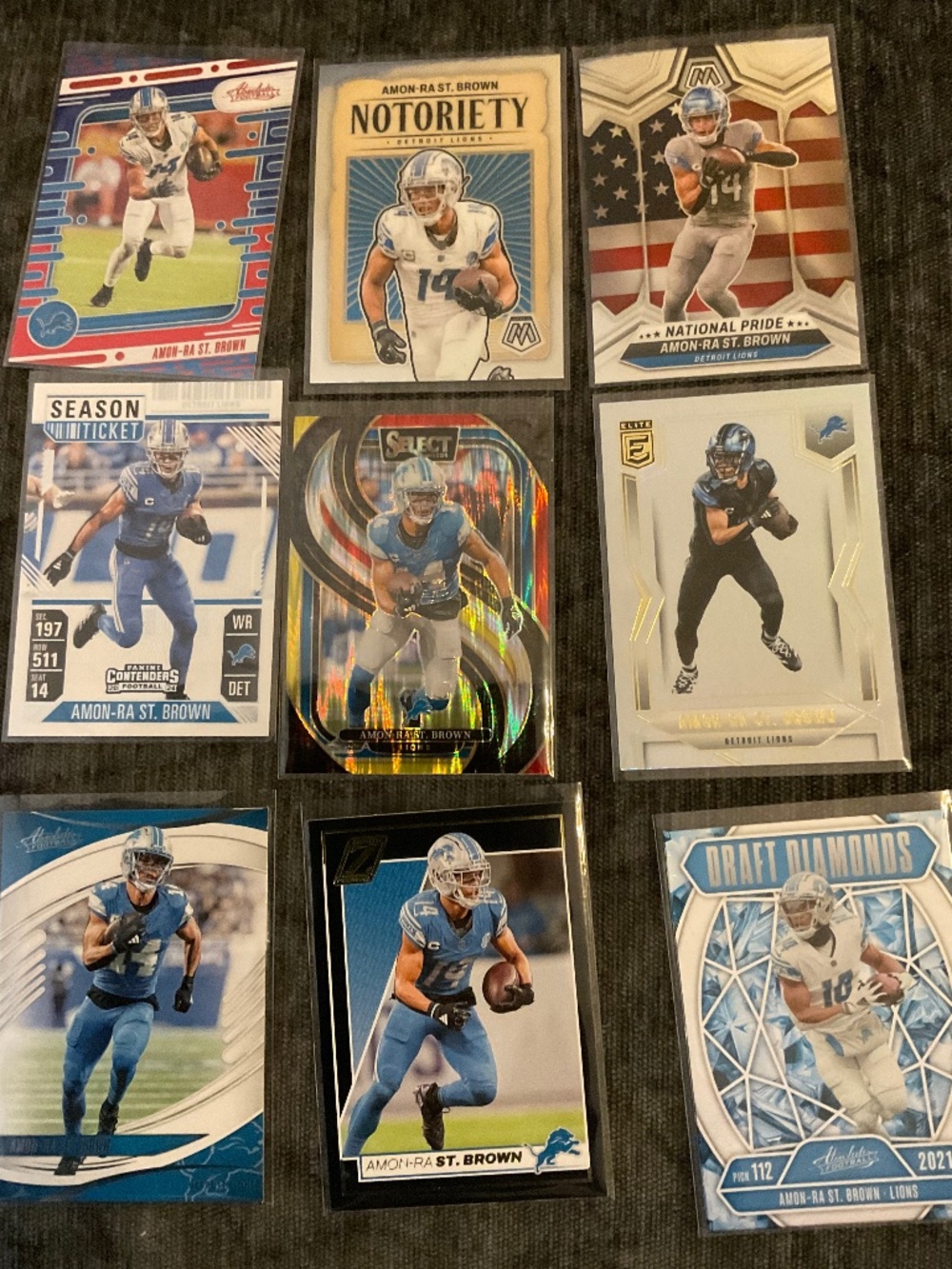 Amon-Ra St. Brown 9 Card Lot: Zenith, Select, Elite, Mosaic, Absolute